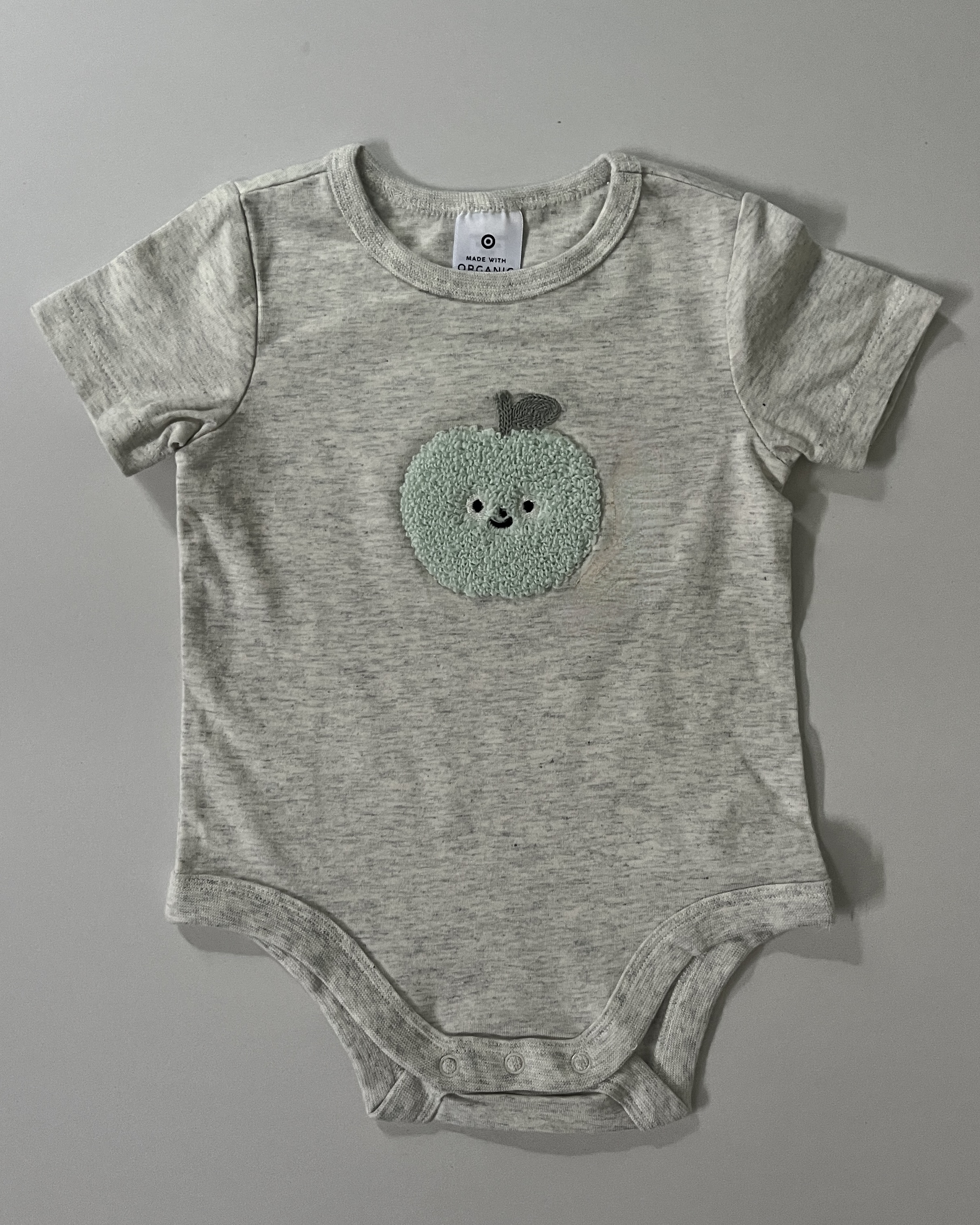 green apple appliqué onsie