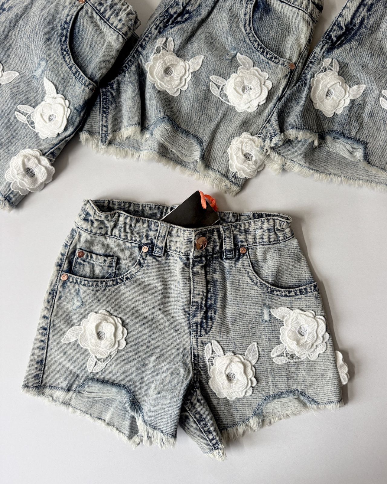 Floral appliqué denim shorts